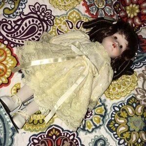 Elegant Cream Porcelain Doll with Brown Hair